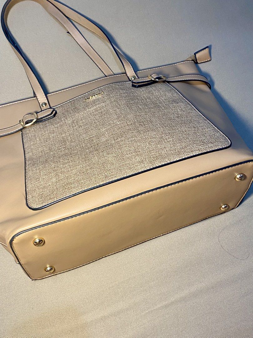 Michaela Tote Bag - Beige with Gold Accent (Category: Tote Bags) located in Makati City. Submitted by style__snap (Listing ID 1444542872, Image 2). Description: 100% original Beige Michaela tote bag - Textured gold panel with buckle details on the front - Interior lining features all-over Michaela logo print - Ample space for essentials - Ideal for everyday use or work tote bag can fit laptop and ipad.