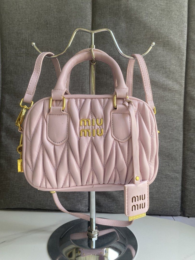Miu Miu Matelassé Mini Bag Pink (Category: Luxury Bags & Wallets) located in Dumaguete. Submitted by rl.bagsavenue (Listing ID 1444649559, Image 3). Description: - Super cute Miu Miu mini bag - Pink color with gold hardware - Quilted matelassé design - Top handle and detachable shoulder strap - Includes a small white tag inside - Ideal for carrying essentials.