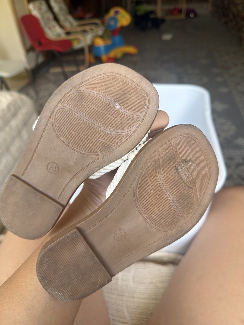 MMF White Knotted Slide Sandals Size 23 (Category: Babies & Kids Fashion) located in Pasig City. Submitted by atticfindsqc (Listing ID 1444519322, Image 2). Description: - White KMF slide sandals - Features a cute knotted detail on the strap - Size 23 - Insole embossed with MMF logo - Easy to slip on and off Sole length 7 inches.