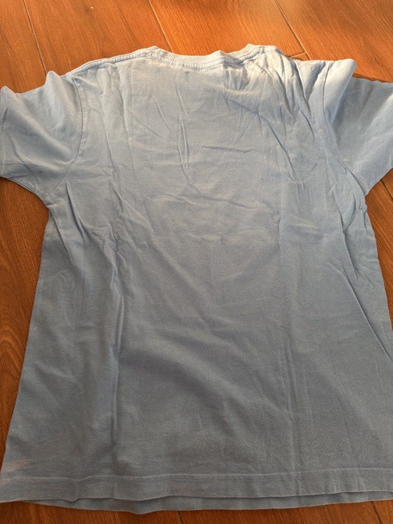 Mossimo Surf Blue T-shirt Size M (Category: Tshirts & Polo Shirts ) located in Bulacan. Submitted by emjay_17 (Listing ID 1444578787, Image 3). Description: - Brand: Mossimo Surf - Color: Light Blue - Size: Medium (M) - Design: Front graphic print featuring a peace sign and heart - Style: Casual wear.