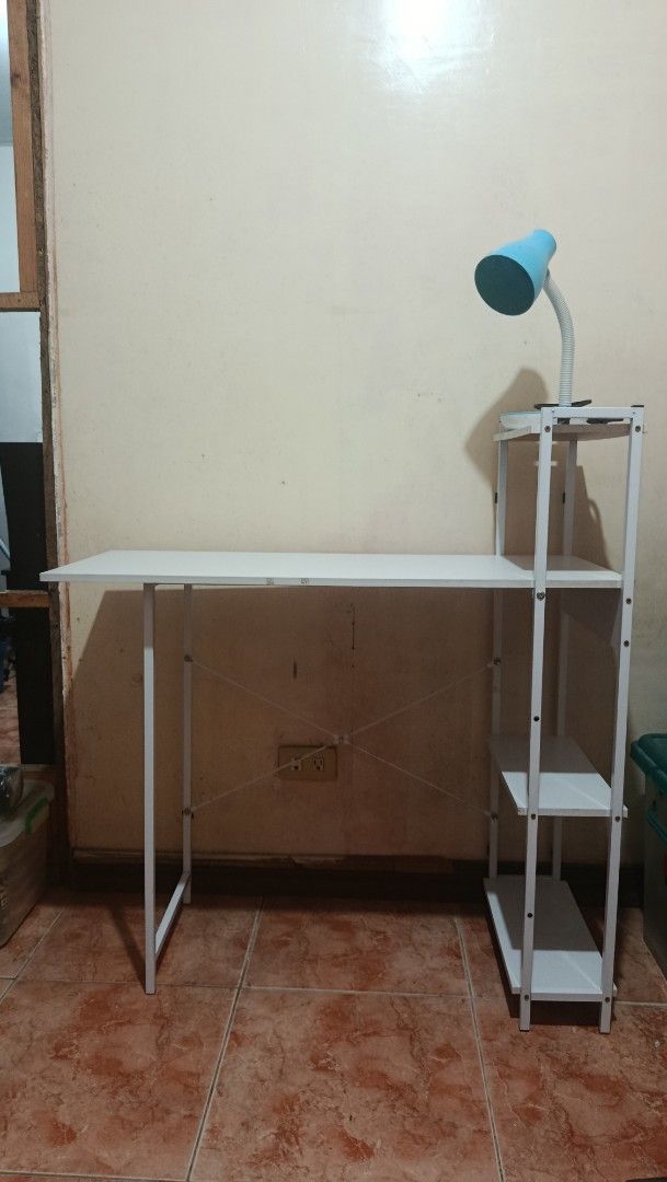 Multi-purpose computer study table (Category: Lighting) located in Manila. Submitted by floydramone (Listing ID 1444650595, Image 1). Description: - White study desk with integrated shelving unit - Includes a blue adjustable lamp - Ideal for students or home office setups - Generous surface area for work or study - Shelves provide convenient extra storage - Simple and easy assembly process - Lamp is fully functional No issues Ready to use Loc. Im