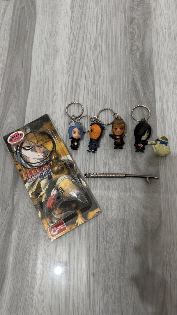 Naruto Akatsuki Keychain Set & Gourd Necklace (Category: Character Goods) located in Taguig. Submitted by am1622 (Listing ID 1444548669, Image 1). Description: - Set of 4 Naruto Akatsuki keychains: Konan, Tobi, Sasori, Zabuza - Naruto gourd necklace from Comic Alley - All items are in original packaging - Ideal gift for any Naruto fan.