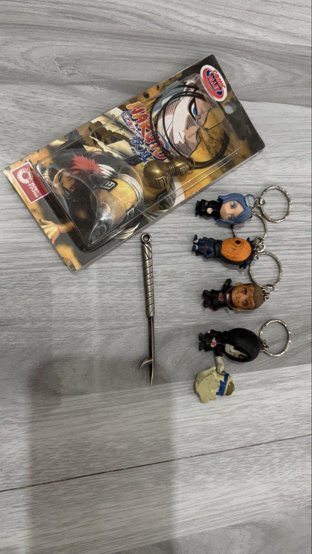 Naruto Akatsuki Keychain Set & Gourd Necklace (Category: Character Goods) located in Taguig. Submitted by am1622 (Listing ID 1444548669, Image 2). Description: - Set of 4 Naruto Akatsuki keychains: Konan, Tobi, Sasori, Zabuza - Naruto gourd necklace from Comic Alley - All items are in original packaging - Ideal gift for any Naruto fan.