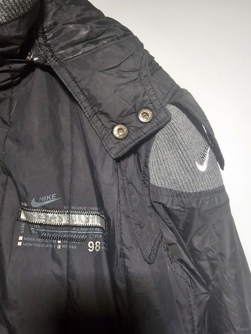 Nike ACG Black Puffer Jacket with Hood (Category: Coats, Jackets and Outerwear) located in Manila. Submitted by thrift_archive (Listing ID 1444633807, Image 2). Description: - Black Nike jacket - Size L - Hooded design - Ribbed cuffs and collar - Large Nike graphic on the back - Multiple front pockets - Ideal for cooler weather dimes 23wx27L.