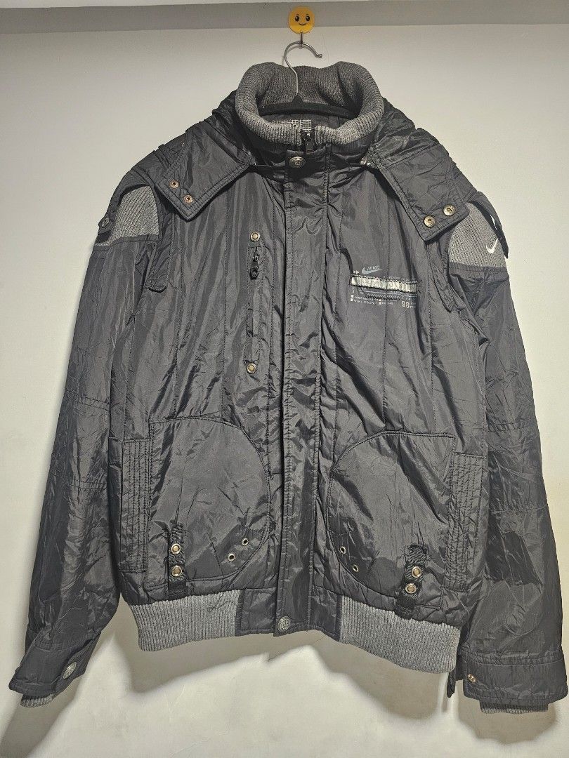 Nike ACG Black Puffer Jacket with Hood (Category: Coats, Jackets and Outerwear) located in Manila. Submitted by thrift_archive (Listing ID 1444633807, Image 1). Description: - Black Nike jacket - Size L - Hooded design - Ribbed cuffs and collar - Large Nike graphic on the back - Multiple front pockets - Ideal for cooler weather dimes 23wx27L.