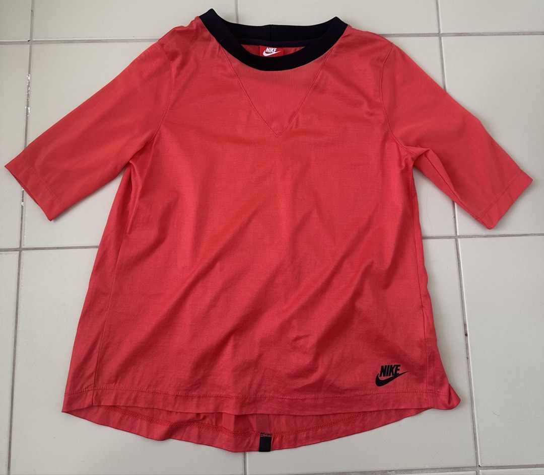 NIKE active shirt red orange (Category: Shirts) located in Cavite. Submitted by jdfselectify (Listing ID 1444544706, Image 1). Description: Very good condition Fits S-M women Drifit material 17W x 21-23L.