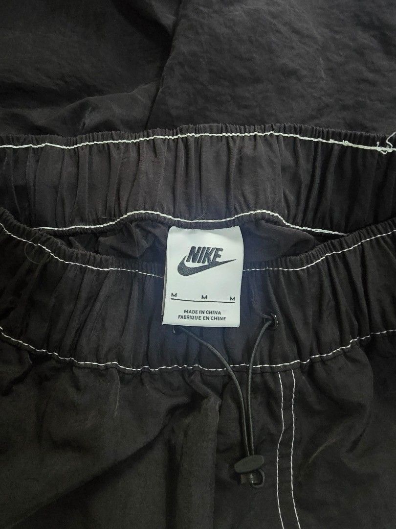 Nike Black Track Pants Joggers Size M (Category: Joggers) located in Makati City. Submitted by patimay (Listing ID 1444614171, Image 3). Description: - Black Nike track pants - Size M - Elastic waistband with drawstring - Two side pockets with white stitching detail - Perfect for casual wear or sports.