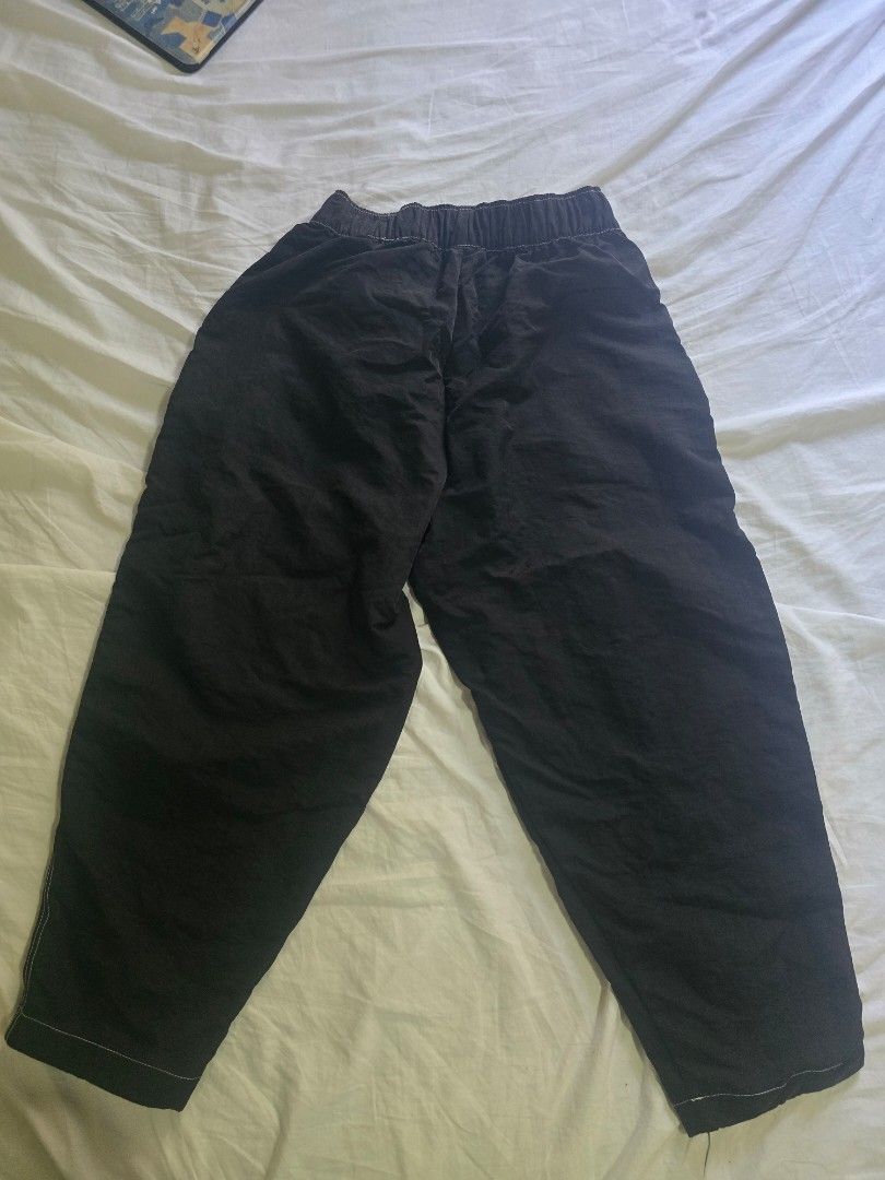Nike Black Track Pants Joggers Size M (Category: Joggers) located in Makati City. Submitted by patimay (Listing ID 1444614171, Image 2). Description: - Black Nike track pants - Size M - Elastic waistband with drawstring - Two side pockets with white stitching detail - Perfect for casual wear or sports.