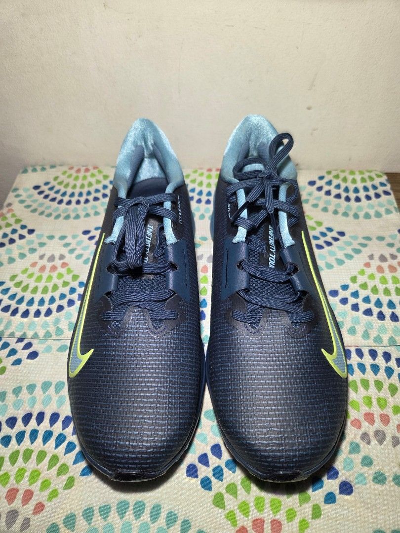 Nike Infinity Tour NEXT% Golf Shoes (Category: Golf) located in Las Pinas. Submitted by milo0502 (Listing ID 1444597344, Image 1). Description: - Nike Infinity Tour NEXT% golf shoes - Color: Dark navy blue with a bright yellow swoosh - Spiked soles for excellent traction - Secure lace-up closure - Perfect for your next golf game -No box.