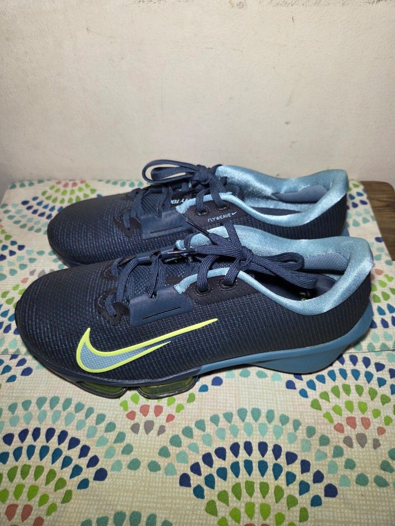 Nike Infinity Tour NEXT% Golf Shoes (Category: Golf) located in Las Pinas. Submitted by milo0502 (Listing ID 1444597344, Image 2). Description: - Nike Infinity Tour NEXT% golf shoes - Color: Dark navy blue with a bright yellow swoosh - Spiked soles for excellent traction - Secure lace-up closure - Perfect for your next golf game -No box.