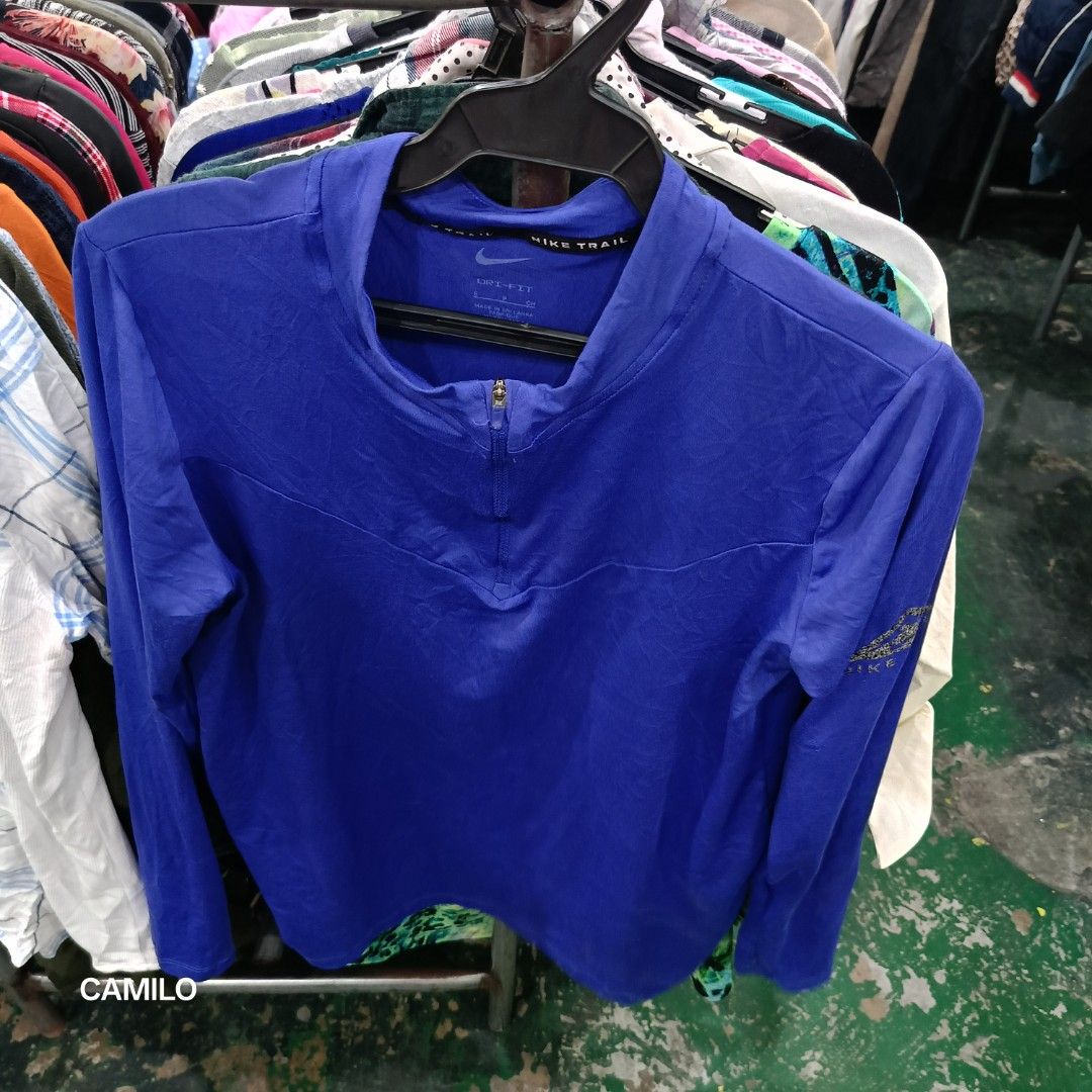 Nike Trail Long Sleeve Running Shirt small (Category: Activewear) located in San Jose del Monte. Submitted by qu4litees (Listing ID 1444589031, Image 2). Description: - Blue Nike Trail long sleeve shirt - Dri-FIT material for comfort and performance - Features a quarter zip at the neck - Nike Trail logo detail on the sleeve - Ideal for running, hiking, or other outdoor activities - Made in Sri Lanka - Size: S.