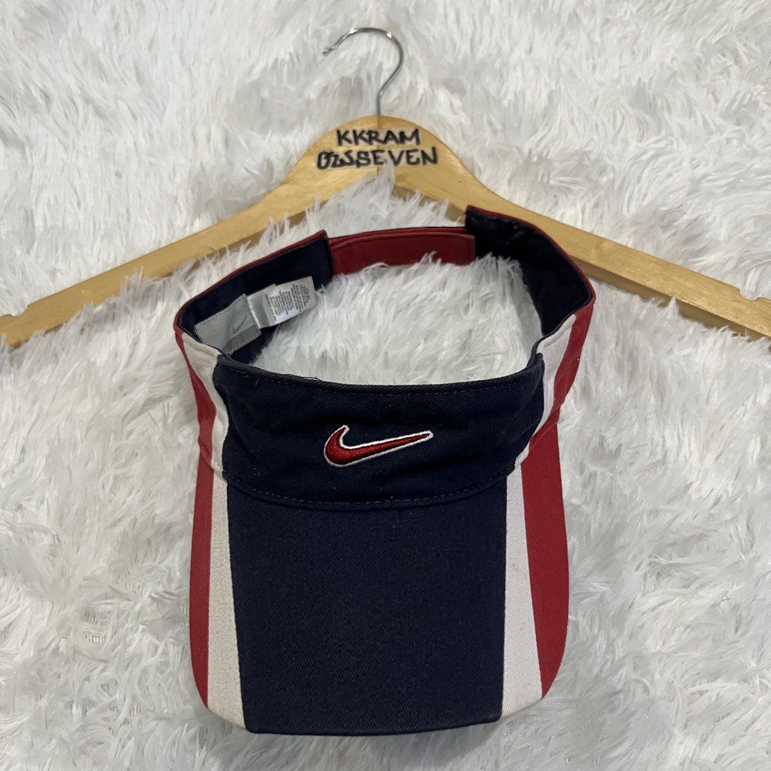 Nike Visor Red White Blue Swoosh (Category: Caps & Hats) located in Manila. Submitted by greedythrifts (Listing ID 1444614544, Image 1). Description: - Classic Nike visor - Features iconic swoosh logo - Red, white, and navy blue color blocking - Ideal for sports or casual wear - Adjustable strap for a comfortable fit - Keeps the sun out of your eyes.