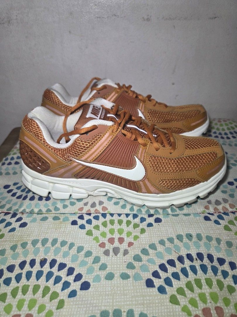 Nike Vomero 5 Monarch (Category: Sneakers) located in Las Pinas. Submitted by milo0502 (Listing ID 1444595655, Image 1). Description: - Orange and white Nike running shoes - Breathable mesh upper - White sole with excellent grip - Bright orange laces - Ideal for running, workouts, or casual wear - No box -used x3.