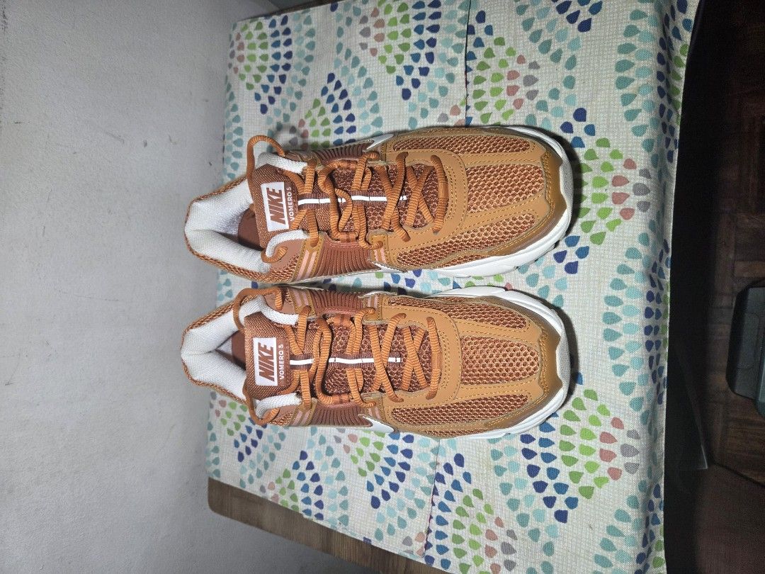 Nike Vomero 5 Monarch (Category: Sneakers) located in Las Pinas. Submitted by milo0502 (Listing ID 1444595655, Image 2). Description: - Orange and white Nike running shoes - Breathable mesh upper - White sole with excellent grip - Bright orange laces - Ideal for running, workouts, or casual wear - No box -used x3.