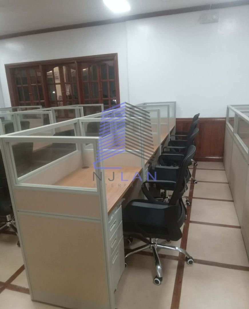 Office Cubicles with Desks and Chairs (Category: Office Furniture & Fixtures) located in Quezon City. Submitted by kylacutie (Listing ID 1444500706, Image 2). Description: Selling office cubicles. Each unit includes a desk and a rolling chair. The cubicles have glass partitions and wooden desk surfaces. Some units have built-in drawers. Great for setting up a workspace. Available in multiple configurations. Contact for details and pricing..