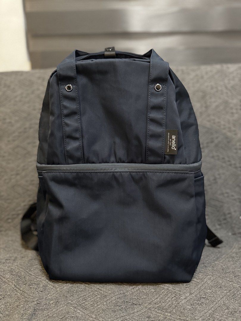 Original Anello Double Layer Backpack (Category: Backpacks) located in Agno. Submitted by ursecondhand_chic (Listing ID 1444602005, Image 1). Description: Original Anello Backpack •Color: Navy Blue •Used only thrice in a short trip - See 2nd to the last pic for minor flaw RFS: Will get a bigger one for camping.