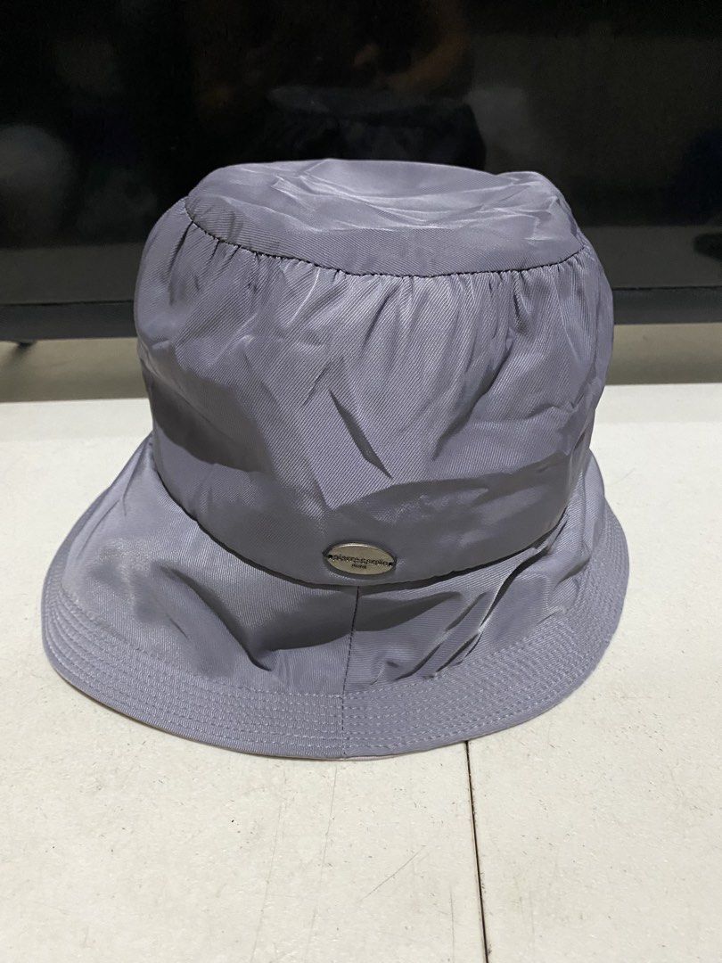 Pierre Cardin Paris Bucket Hat Grey (Category: Hats & Beanies) located in Manila. Submitted by resi.diaz (Listing ID 1444659356, Image 2). Description: - Brand: Pierre Cardin Paris - Color: Grey - Material: Shiny fabric - Features: Side brand logo - Style: Bucket hat - Occasion: Sunny days, casual wear - Benefits: Easy to pack, versatile styling.