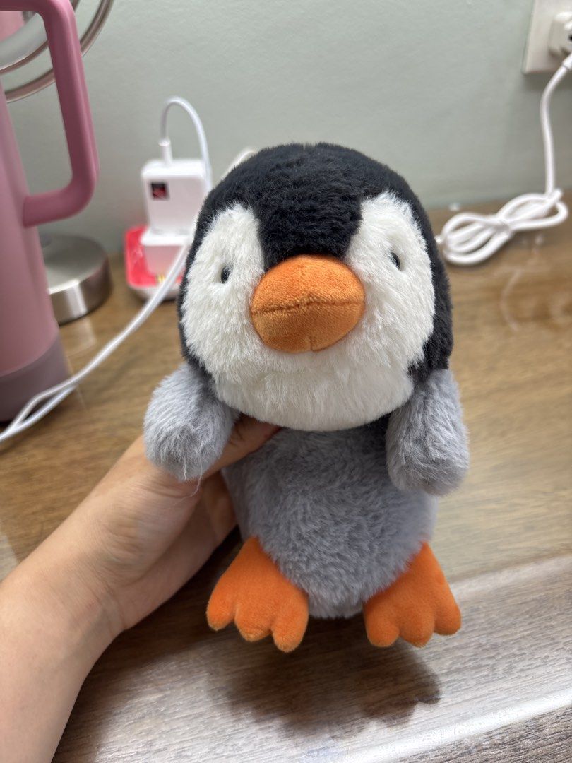 Posture Pals Penguin Plush Toy (Category: Plushies & Soft Toys) located in Paranaque City. Submitted by corinne_see (Listing ID 1444548629, Image 3). Description: - Adorable penguin plush toy from the Posture Pals collection. - Soft and fluffy grey and black body. - Features cute orange feet and beak. - Approximately 5 inches tall. - Brand new with tag attached. - Ideal for plush collectors or as a charming desk companion..