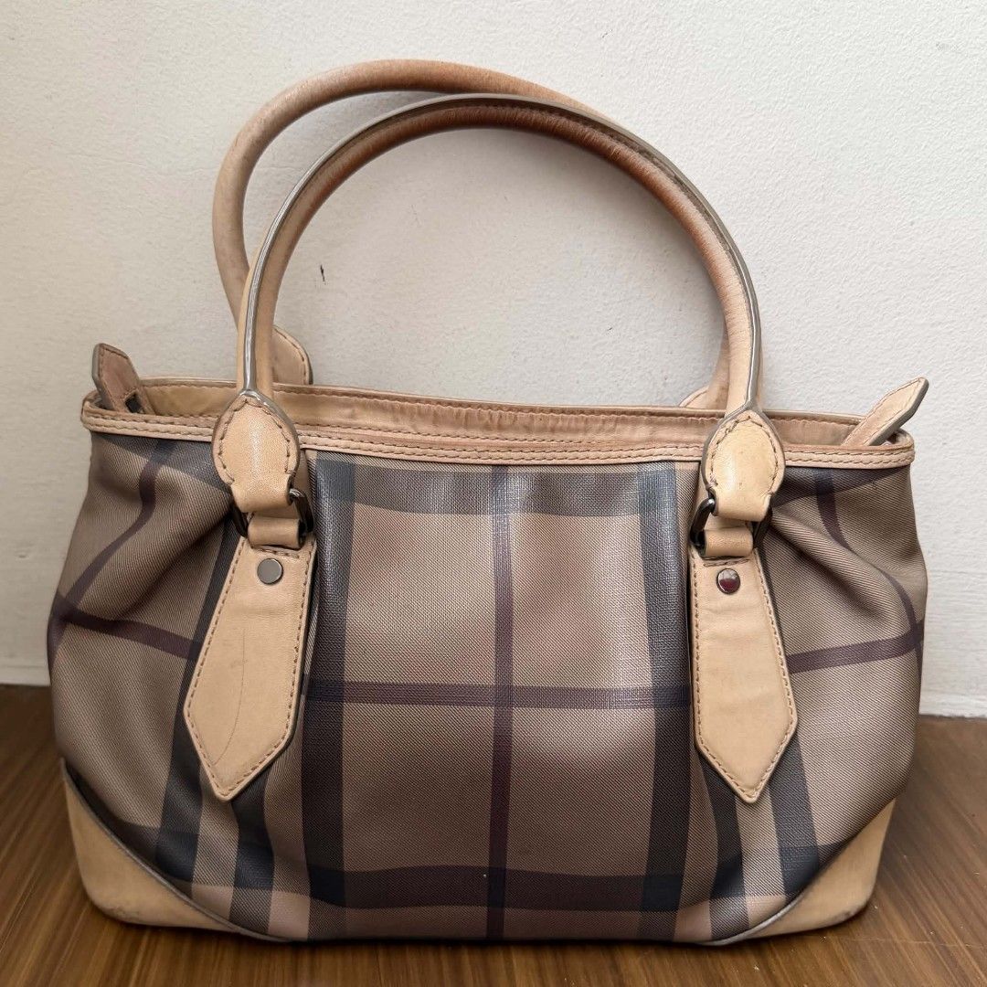 Pre Owned Authentic BURBERRY Smoke-Check Bag (Category: Luxury Bags & Wallets) located in Paranaque City. Submitted by Glamfahd (Listing ID 1444580367, Image 3). Description: Pre Owned Authentic BURBERRY Bag Inclusion/s: None Condition Well Used condition Signs of use Marks/dirt/scratches on exterior Bag is really a great buy! Please manage your expectations as you are buying an authentic second hand item at a fraction of the cost.