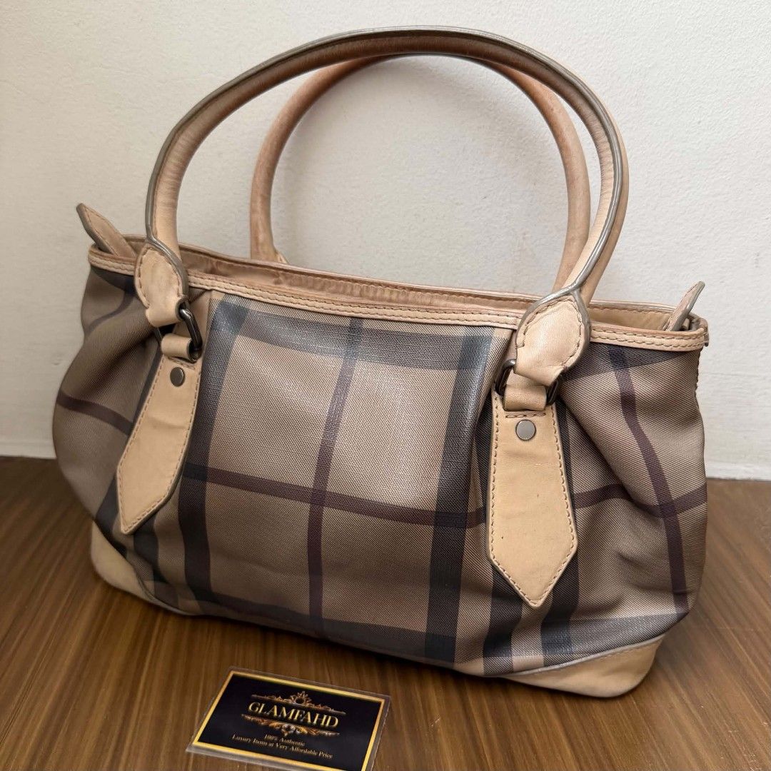 Pre Owned Authentic BURBERRY Smoke-Check Bag (Category: Luxury Bags & Wallets) located in Paranaque City. Submitted by Glamfahd (Listing ID 1444580367, Image 2). Description: Pre Owned Authentic BURBERRY Bag Inclusion/s: None Condition Well Used condition Signs of use Marks/dirt/scratches on exterior Bag is really a great buy! Please manage your expectations as you are buying an authentic second hand item at a fraction of the cost.