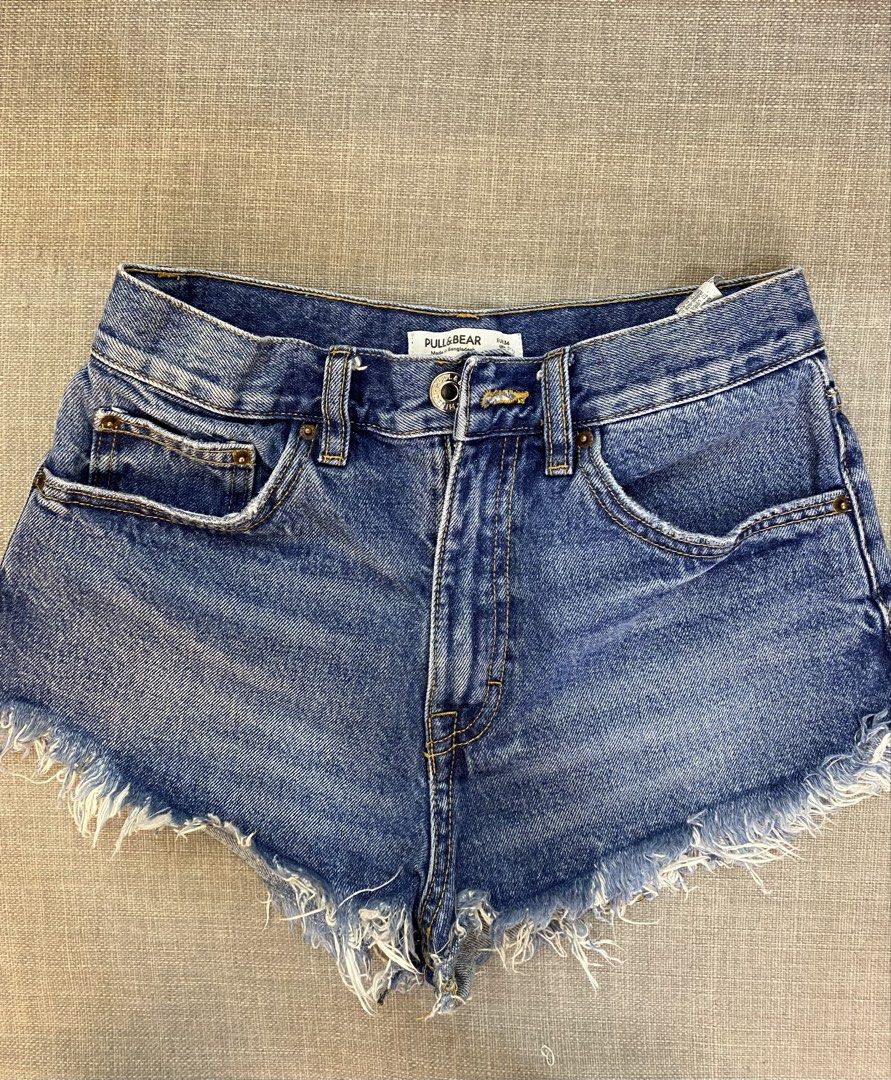 Pull & Bear Blue Denim Frayed Hem Shorts (Category: Shorts) located in Cebu City. Submitted by jnnwright (Listing ID 1444618053, Image 1). Description: - Cute blue denim shorts - Brand: Pull & Bear - Style: High-waisted - Feature: Frayed hem - Design: Classic 5-pocket - Perfect for: Casual wear - Easy to pair with any top - Origin: Made in Bangladesh.