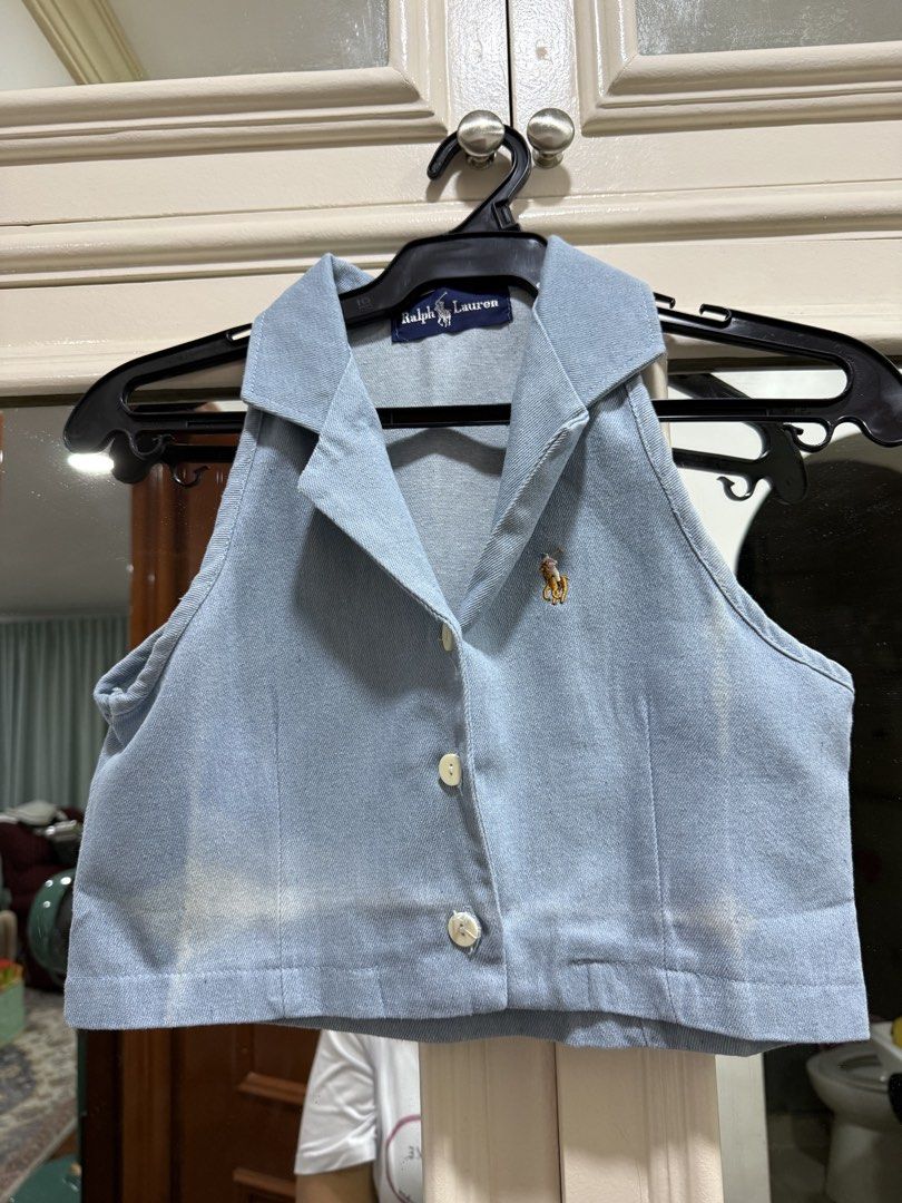 Ralph Lauren Denim Halter Crop Top (Category: Sleeveless) located in Quezon City. Submitted by jiafoo (Listing ID 1444613921, Image 1). Description: - Brand: Ralph Lauren - Style: Light wash denim halter top - Neckline: Collared - Closure: Button-up front - Length: Cropped - Details: Embroidered polo player logo on chest - Sleeves: Sleeveless - Occasion: Casual wear.