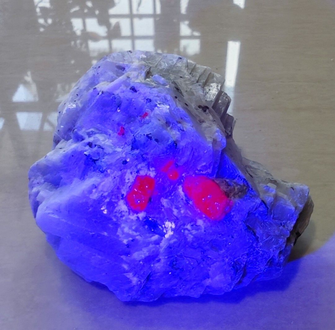 Ruby crystal on matrix (Category: Precious Stones) located in Singapore. Submitted by ys_heng (Listing ID 1444594213, Image 2). Description: - Ruby (main crystal approx 1cm) on matrix from Myanmar - It shows strong fluoresce under UV light .