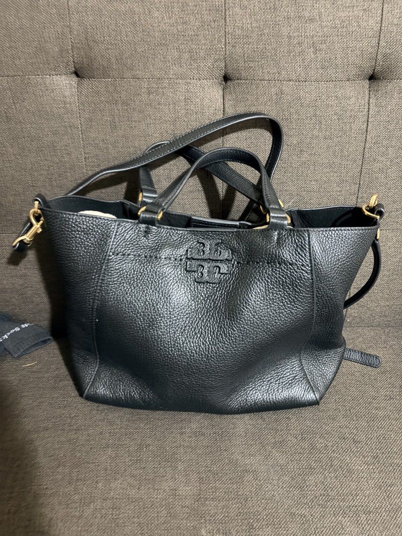 Tory Burch Black Leather Two Way Tote Bag (Category: Luxury Bags & Wallets) located in Quezon City. Submitted by pattycloset08 (Listing ID 1444549488, Image 2). Description: - Genuine black leather Tory Burch tote bag - Versatile with top handles and a detachable crossbody strap - Elegant gold hardware accents - Secure magnetic snap closure - Ample interior space for all your essentials - Ideal for everyday wear and errands Issue please see last 