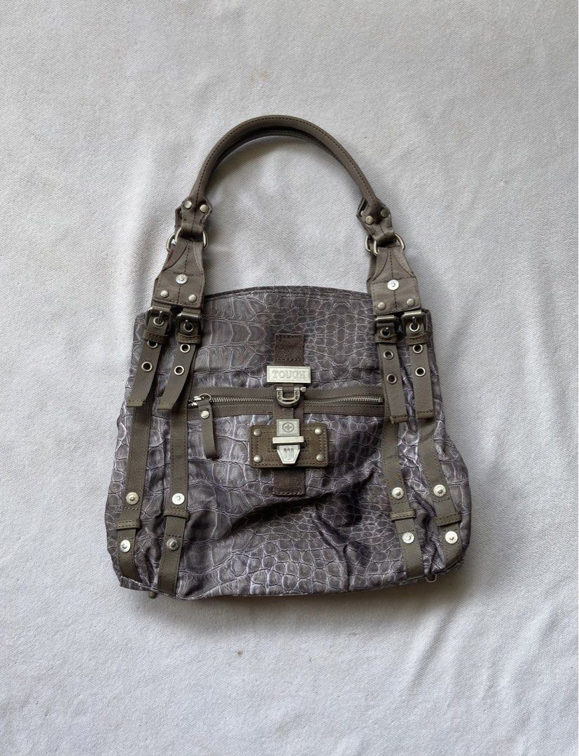 Tough Jeansmith crocskin shoulder bag (Category: Shoulder Bags) located in Makati City. Submitted by ullox (Listing ID 1444541068, Image 1). Description: Cool grey tote bag with croc print. Has zip pockets and buckle details. Vibrant purple interior. Durable fabric, vintage military style. Perfect for daily use..