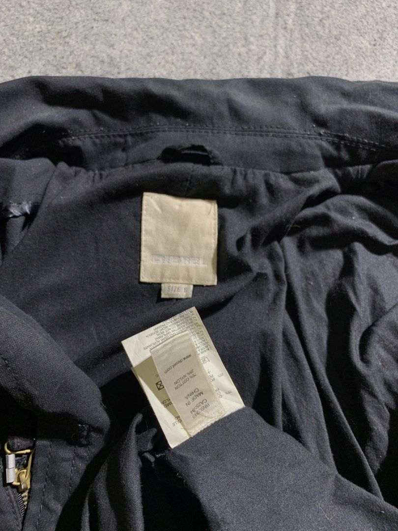 VINTAGE DIESEL Archive Tactical Multi-Pocket Utility Jacket (Category: Coats, Jackets and Outerwear) located in Zamboanga. Submitted by zhifay (Listing ID 1444668668, Image 3). Description: VINTAGE DIESEL Archive Tactical Multi-Pocket Utility Jacket Early-2000s Diesel tactical utility jacket. Features heavy industrial paneling, functional multi-pocket setup, dual brass chest zippers, and a rugged 75/25 cotton-nylon canvas blend. Classic archive p