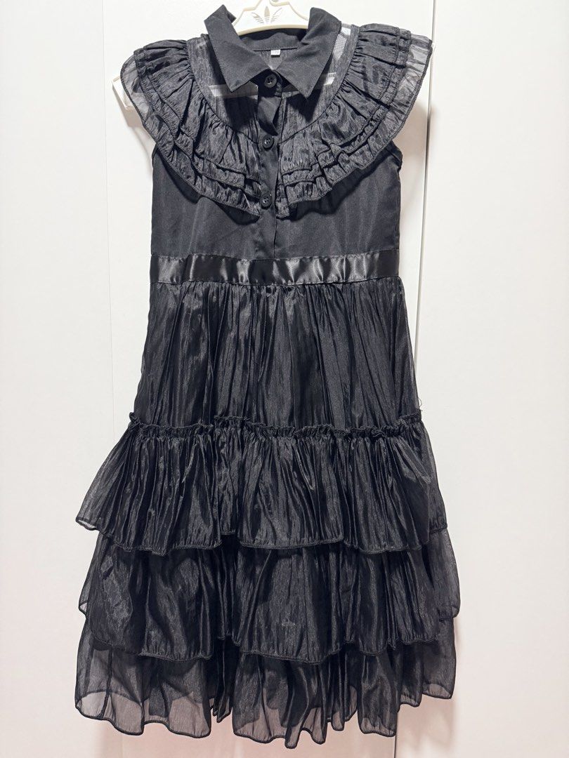 Wednesday black dress (Category: Babies & Kids Fashion) located in Pasig City. Submitted by decluttery8 (Listing ID 1444603874, Image 1). Description: Once used only.