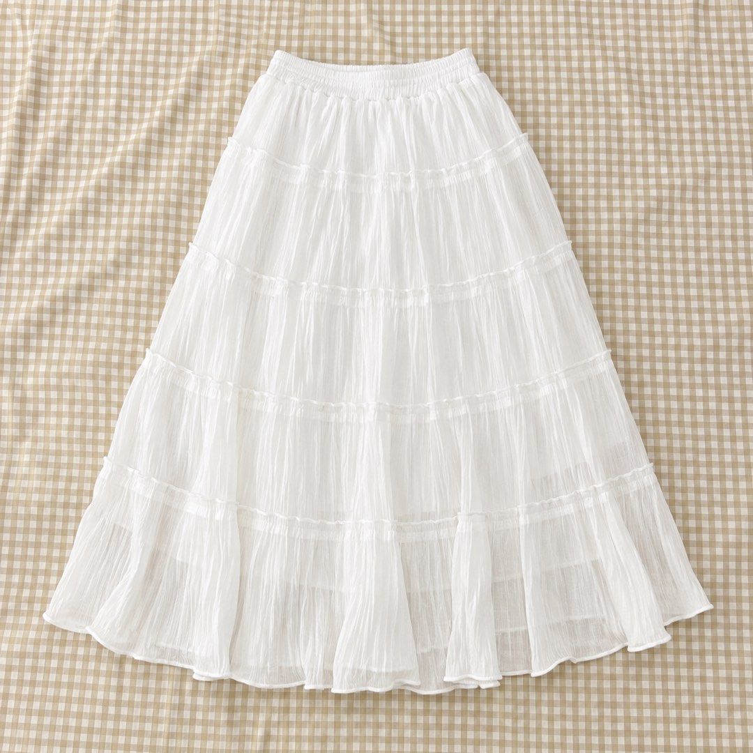 Sale White Tiered Skirt (Category: Skirts) located in Iloilo. Submitted by lovedbysachi (Listing ID 1444644645, Image 1). Description: Free size (garterized waist) Super duper pretty in person 🥹 with inner lining.