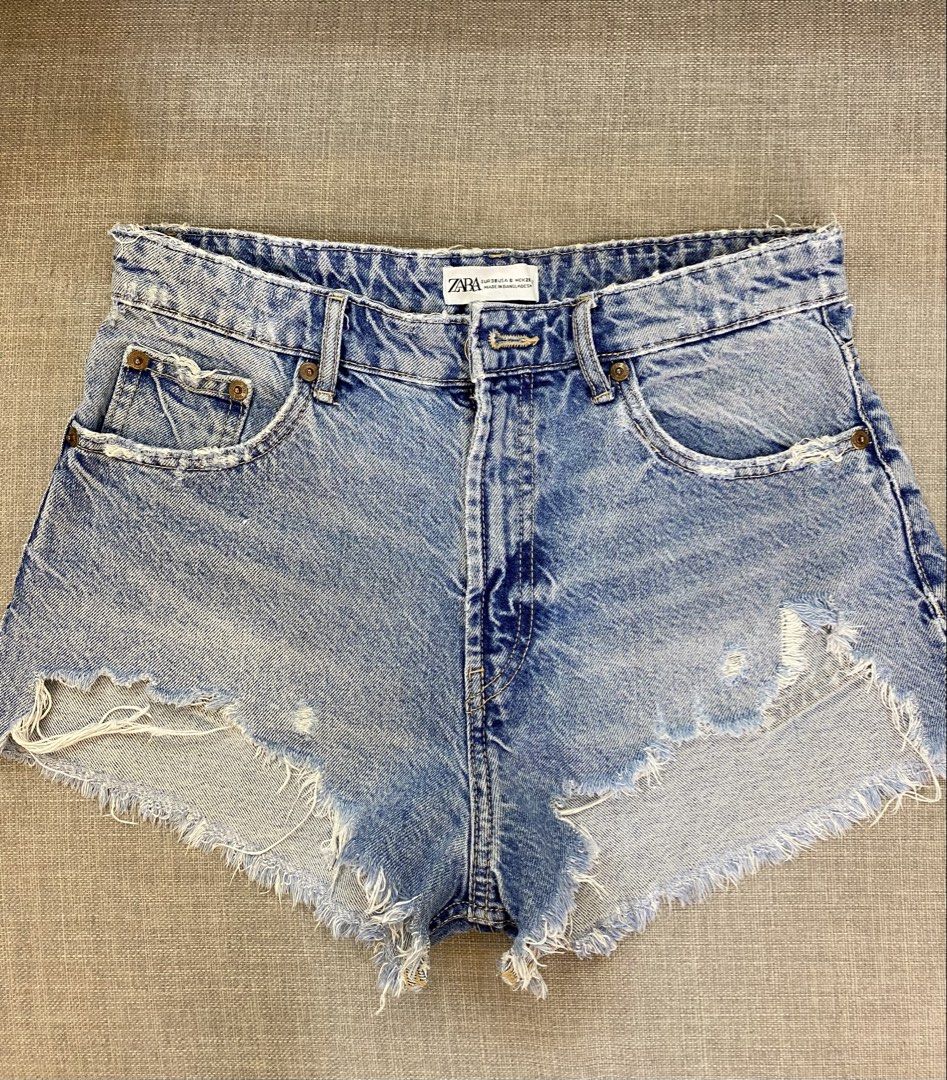 Zara Blue Distressed Denim Shorts (Category: Shorts) located in Cebu City. Submitted by jnnwright (Listing ID 1444617787, Image 1). Description: - Cute Zara denim shorts - Light blue wash - Distressed look - Frayed hem for a casual vibe - Ideal for summer outfits - Versatile: easy to pair with any top.
