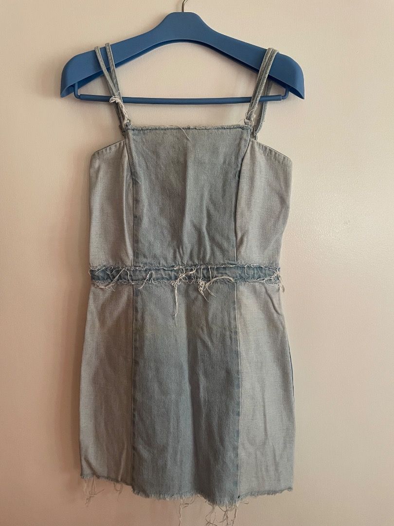 Zara Light Wash patchwork Denim Mini Dress with adjustable Straps (Category: Dresses) located in Paranaque City. Submitted by cngaya (Listing ID 1444573826, Image 2). Description: - Light wash patchwork denim mini dress - Square neckline - Adjustable straps - Distressed raw details at waist and hem - Criss-cross back straps - Zipper closure - Ideal for casual outings - Please do not send me lowball offers, I would appreciate it if respect would b