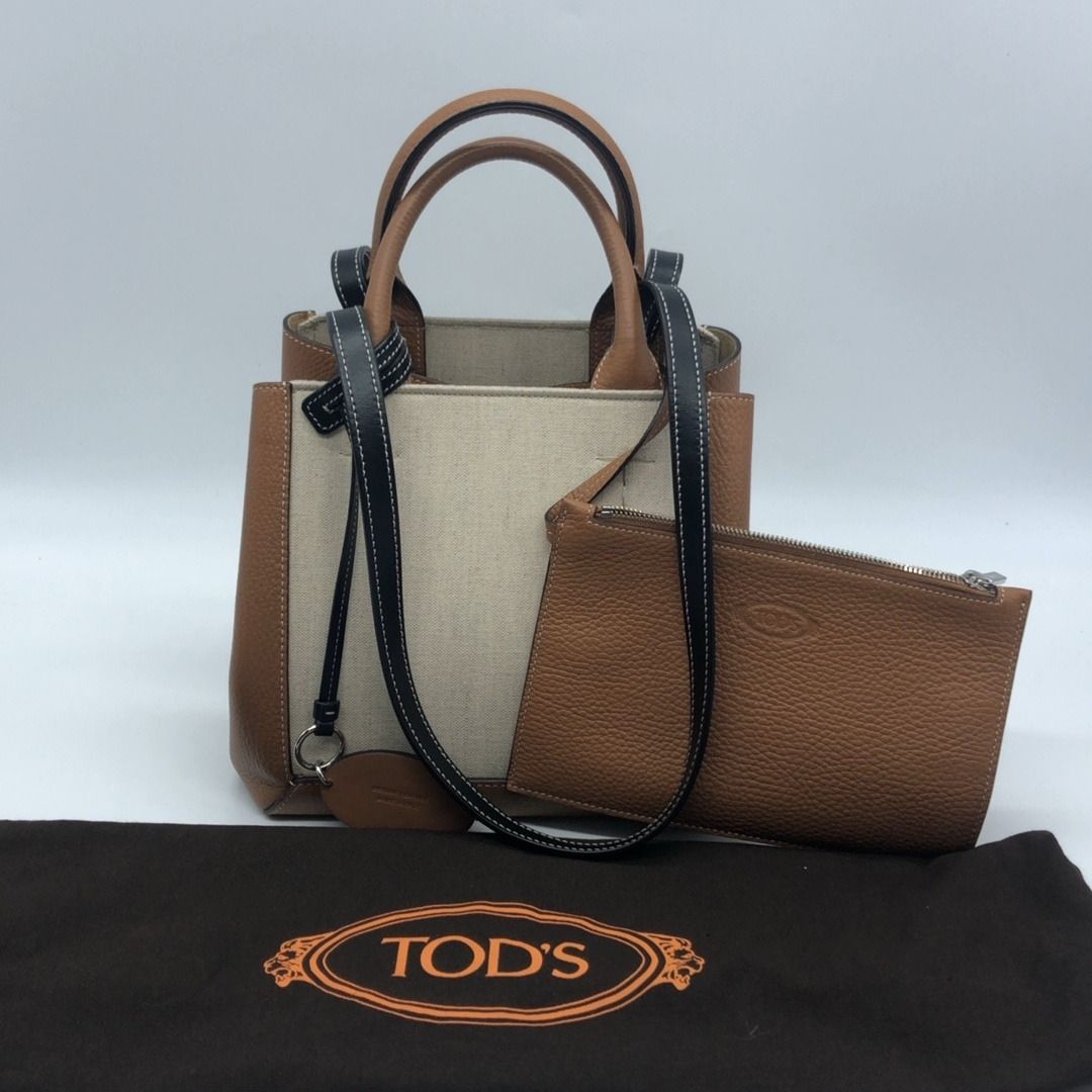 267005651 TODS BAG CANVAS DOUBLE UP TOTE (Category: Luxury Bags & Wallets) located in Taguig. Submitted by ecoring.ph (Listing ID 1444694321, Image 2). Description: ◆CONDITION: B+ ◆DESCRIPTIONS: (Other defects/info:) The bottom and bottom corners of the bag have minimal scuffing, stains, and press marks, and show signs of use. The longer top handle strap of the bag has minimal wrinkles and press marks. Overall, the bag remains in new and good con