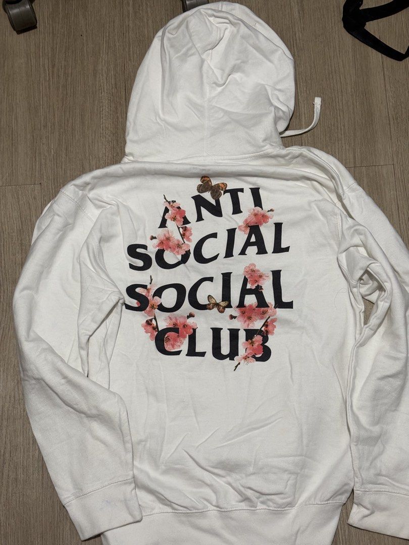 Anti Social Social Club White Zip-Up Hoodie Cherry Blossom Butterfly (Category: Coats, Jackets and Outerwear) located in San Pedro. Submitted by calendolagallery (Listing ID 1444714223, Image 2). Description: - White zip-up hoodie from Anti Social Social Club (ASSC) - Classic ASSC logo prominently displayed on the front - Eye-catching cherry blossom and butterfly graphic on the back - Ideal for everyday, casual styling.