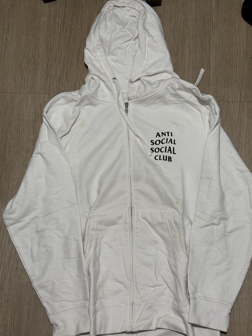 Anti Social Social Club White Zip-Up Hoodie Cherry Blossom Butterfly (Category: Coats, Jackets and Outerwear) located in San Pedro. Submitted by calendolagallery (Listing ID 1444714223, Image 1). Description: - White zip-up hoodie from Anti Social Social Club (ASSC) - Classic ASSC logo prominently displayed on the front - Eye-catching cherry blossom and butterfly graphic on the back - Ideal for everyday, casual styling.