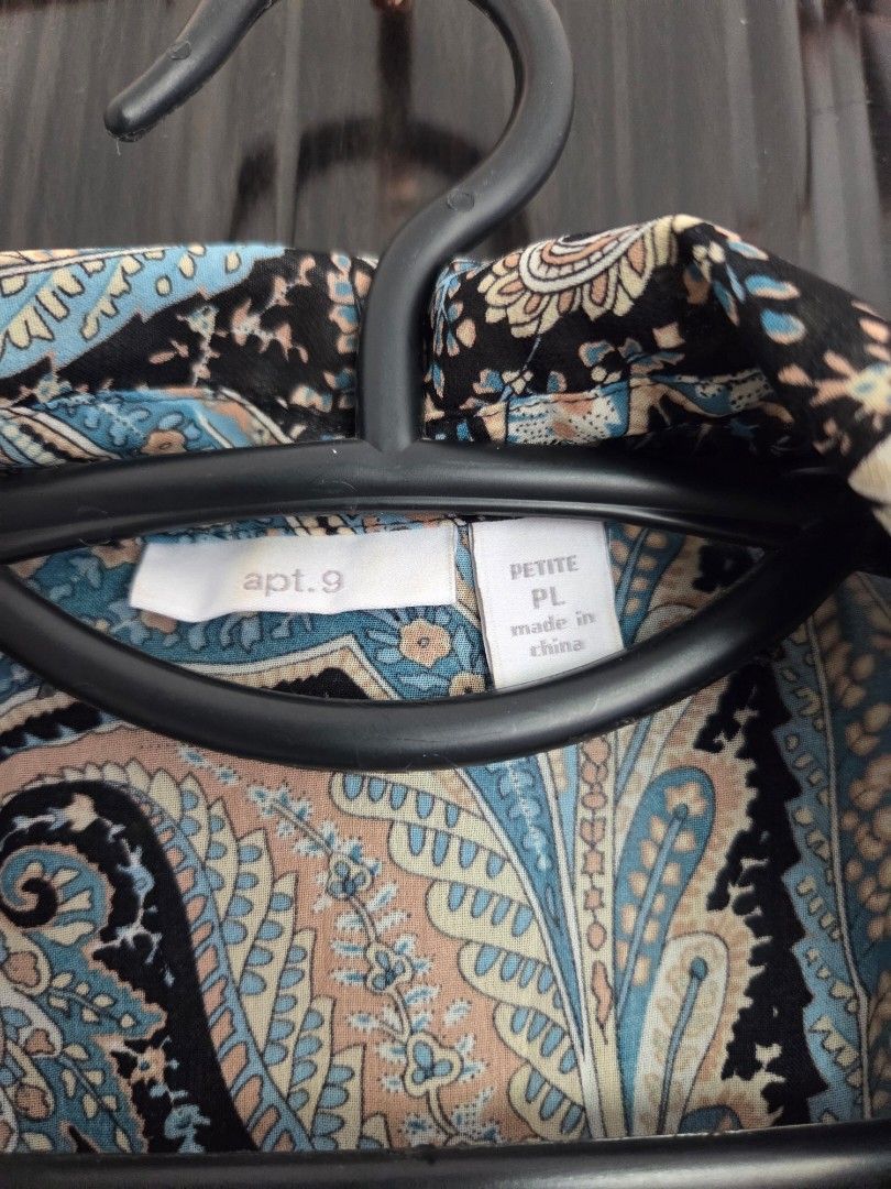 Apt. 9 Petite Paisley Print Button-Up Shirt (Category: Shirts) located in Bacolod City. Submitted by maraline (Listing ID 1444768576, Image 2). Description: - Petite button-up shirt from Apt. 9 - Black base with blue and tan paisley print - Long sleeves with button cuffs - Lightweight fabric feel - Versatile for casual or work attire - Measurements available upon request.