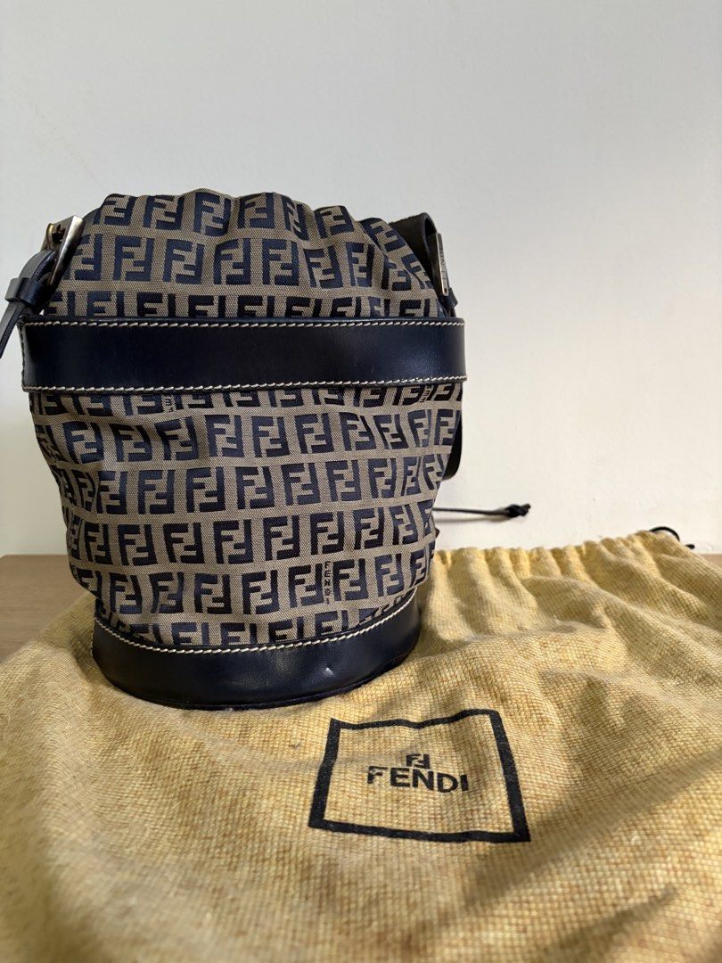 AUTHENTIC Fendi Zucca Monogram Canvas Bucket Bag (Category: Luxury Bags & Wallets) located in Quezon City. Submitted by clozettreasures (Listing ID 1444697707, Image 1). Description: - Guaranteed Authentic Fendi bucket bag - Classic Zucca monogram print on canvas - Black leather trim and drawstring closure - Comes with original dust bag - Ideal for everyday use - A timeless Fendi piece.
