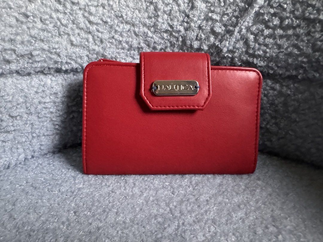 Authentic Nautica Red Bi-Fold Wallet with RFID Protection (Category: Wallets & Card holders) located in Quezon City. Submitted by katharus (Listing ID 1444747281, Image 1). Description: - Red Nautica bi-fold wallet - Multiple card slots and ID window - Zippered coin pocket - RFID protection for enhanced security - Compact and portable design .