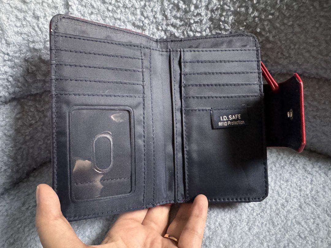 Authentic Nautica Red Bi-Fold Wallet with RFID Protection (Category: Wallets & Card holders) located in Quezon City. Submitted by katharus (Listing ID 1444747281, Image 3). Description: - Red Nautica bi-fold wallet - Multiple card slots and ID window - Zippered coin pocket - RFID protection for enhanced security - Compact and portable design .