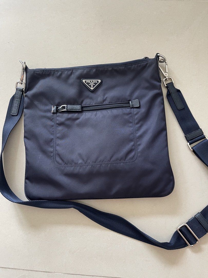 Authentic Prada Nylon Crossbody Bag Navy Blue (Category: Luxury Bags & Wallets) located in Taguig. Submitted by supplementary (Listing ID 1444746323, Image 1). Description: - Authentic Prada crossbody bag Flaws in the picture.