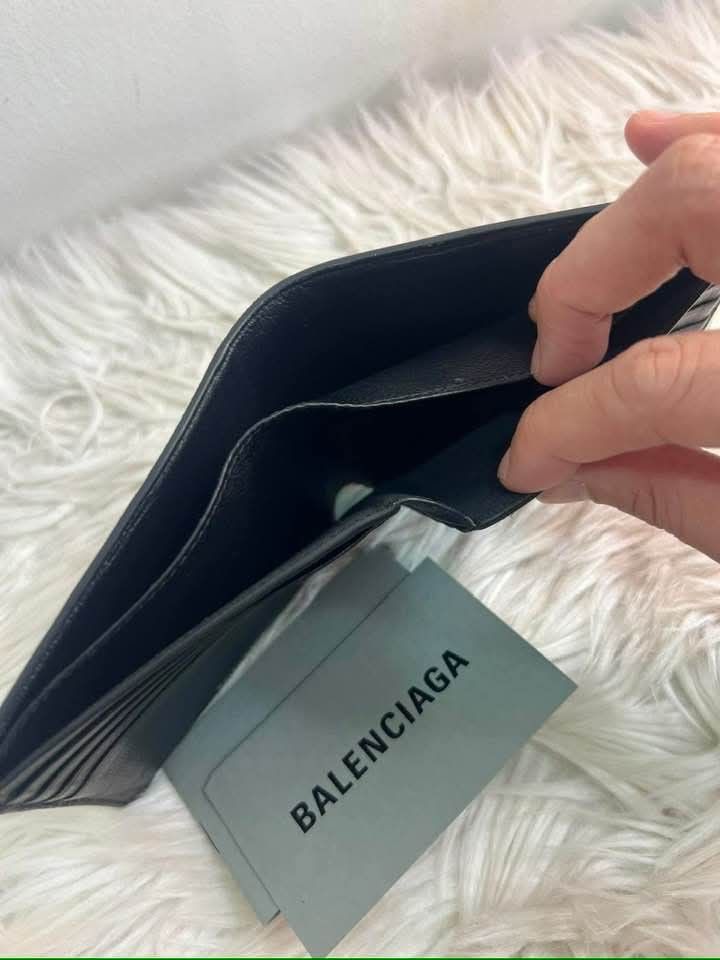 Balenciaga Black Leather Bifold Wallet (Category: Luxury Bags & Wallets) located in Bayugan. Submitted by daniel2019 (Listing ID 1444816722, Image 2). Description: - Authentic Balenciaga wallet - Color: Black - Style: Bifold - Material: Leather -brand new - Features: Multiple card slots - Interior: Clean - Includes: Balenciaga cards - Ideal for: Everyday use.