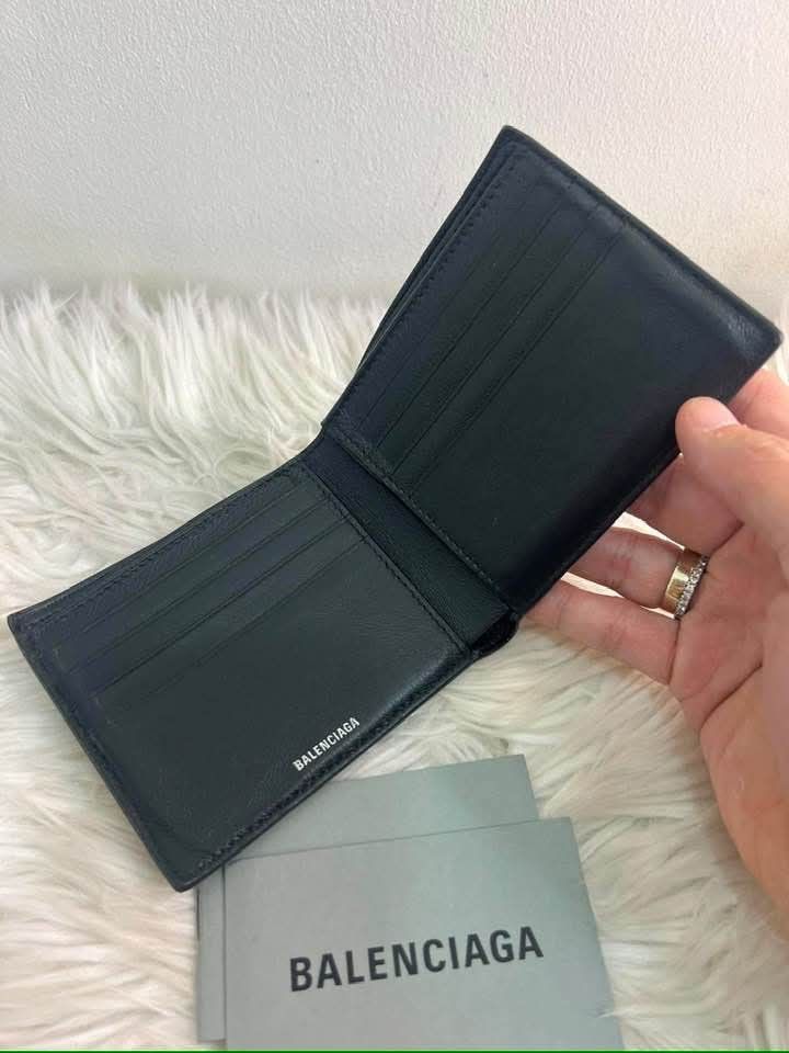 Balenciaga Black Leather Bifold Wallet (Category: Luxury Bags & Wallets) located in Bayugan. Submitted by daniel2019 (Listing ID 1444816722, Image 3). Description: - Authentic Balenciaga wallet - Color: Black - Style: Bifold - Material: Leather -brand new - Features: Multiple card slots - Interior: Clean - Includes: Balenciaga cards - Ideal for: Everyday use.