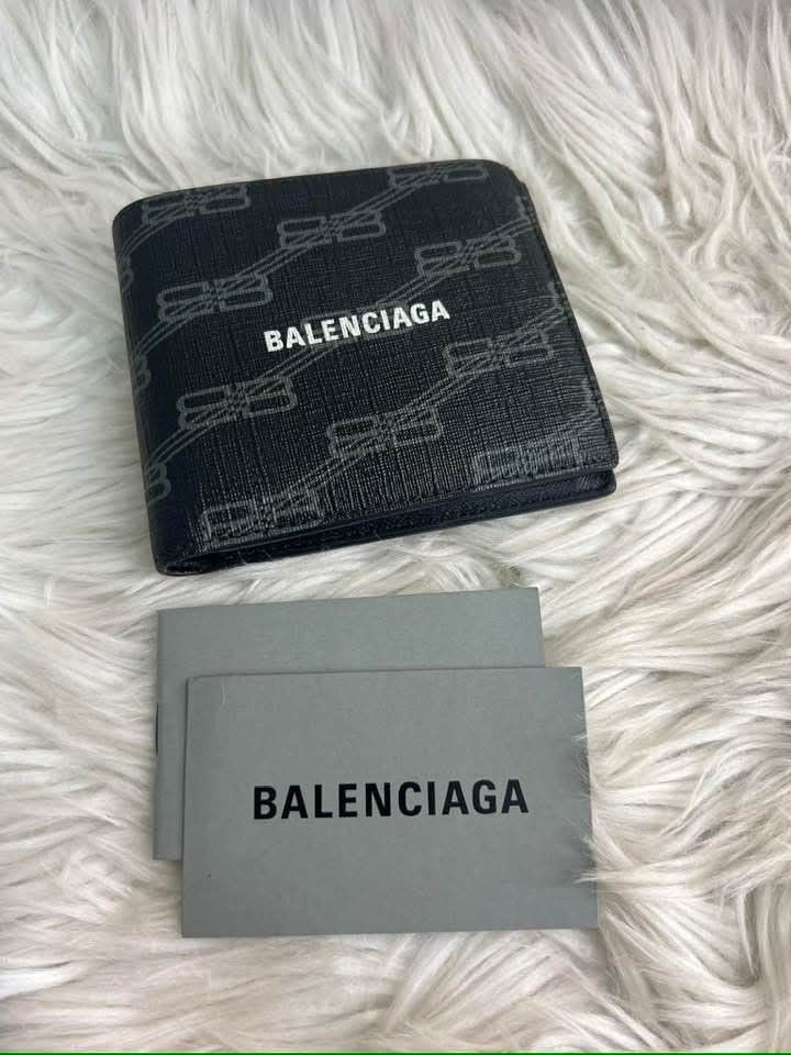 Balenciaga Black Leather Bifold Wallet (Category: Luxury Bags & Wallets) located in Bayugan. Submitted by daniel2019 (Listing ID 1444816722, Image 1). Description: - Authentic Balenciaga wallet - Color: Black - Style: Bifold - Material: Leather -brand new - Features: Multiple card slots - Interior: Clean - Includes: Balenciaga cards - Ideal for: Everyday use.