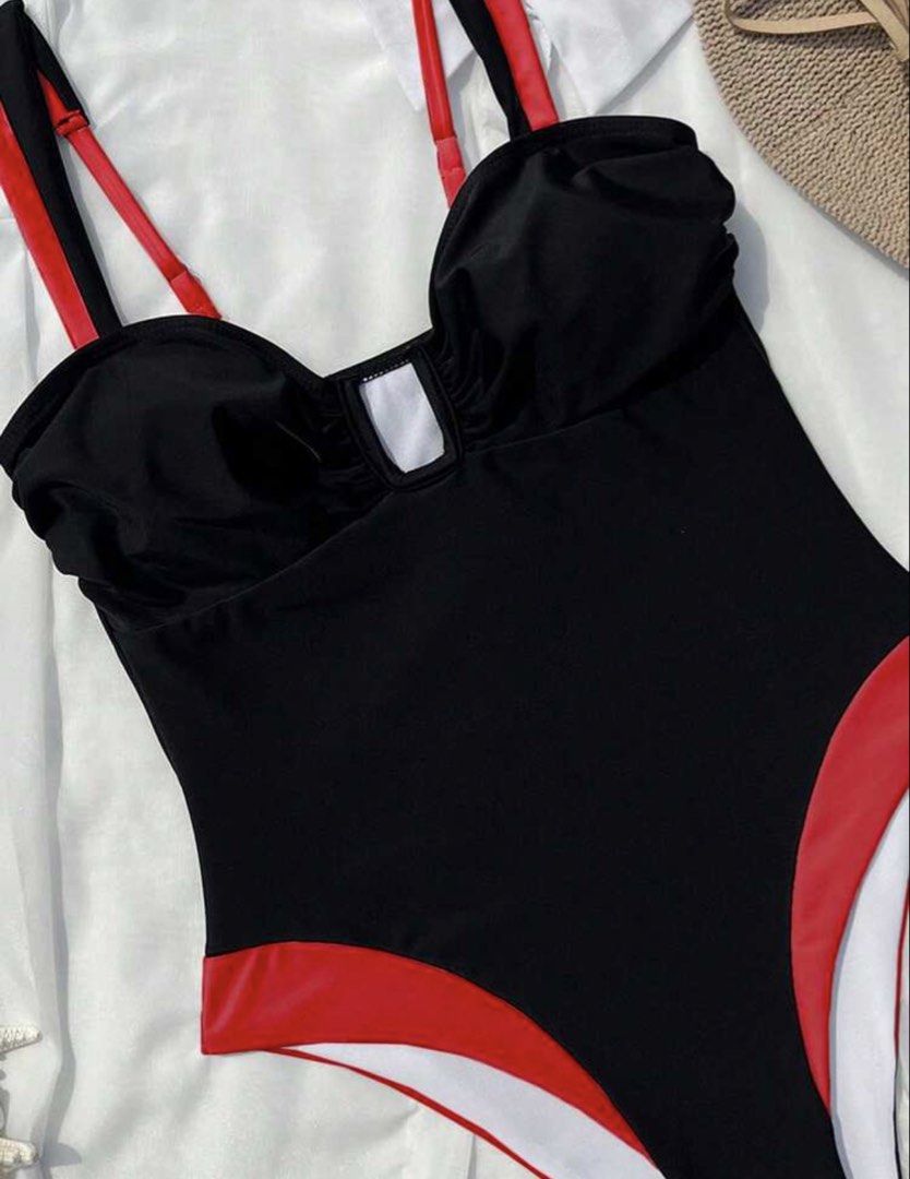 Black & Red High-Cut One-Piece Swimsuit (Category: Bikinis & Swimsuits) located in Taguig. Submitted by _lovedpieces (Listing ID 1444823811, Image 2). Description: - Classic black one-piece swimsuit - Eye-catching red trim - Flattering high-cut leg design - Adjustable straps for a perfect fit - Bust: 26.4 in - Waist: 22.8 in - Hip: 27.2 in - Length: 22 in - Ideal for beach or pool outings.