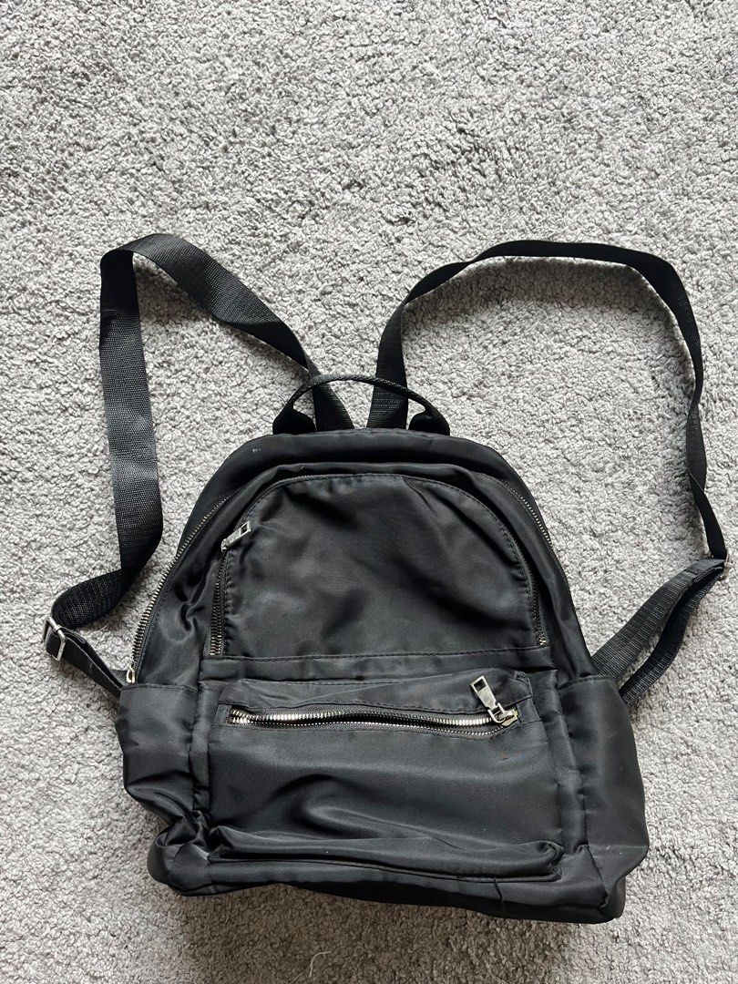 Black backpack (Category: Backpacks) located in Singapore. Submitted by k809876 (Listing ID 1444736675, Image 1). Description: Simple mini black backpack with multiple compartments .