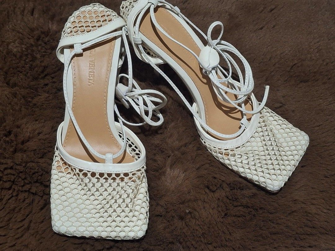 10:10 SALE Bottega Veneta White Sandals (Category: Sneakers & Footwear) located in Lipa City. Submitted by kathethings (Listing ID 1444852019, Image 1). Description: - Brand: Bottega Veneta - Color: White - Material: Mesh upper - Design: Tie-up laces, Square toe - Origin: Made in Italy - Size: 37 - Style: Super chic and unique, perfect for dressing up any outfit..