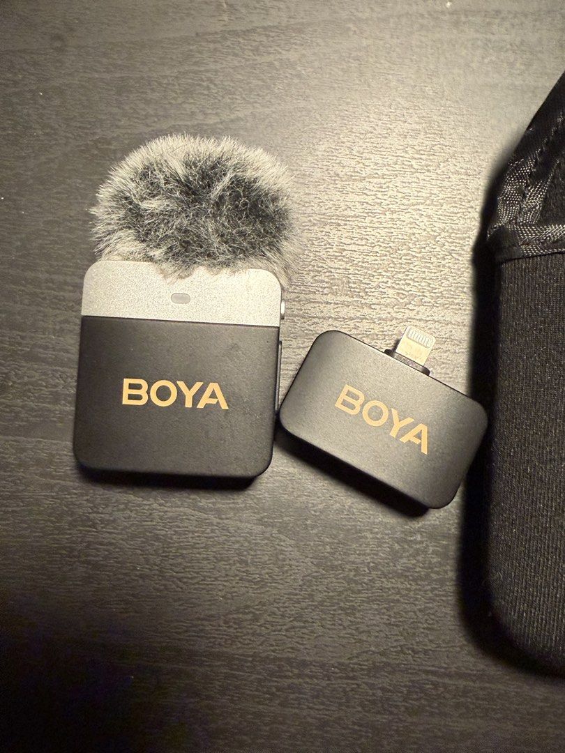 BOYA BY-WM3T2-M2 Wireless Microphone System for iPhone (Category: Microphones) located in Manila. Submitted by deadloxarn23439 (Listing ID 1444706531, Image 1). Description: - BOYA BY-WM3T2-M2 Wireless Microphone System - Perfect for clear audio recording on iPhones - Includes transmitter with built-in microphone - Receiver with Lightning connector for easy iPhone connection - Tested and confirmed working - Comes with a protective pouch for stora