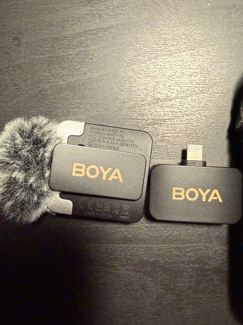 BOYA BY-WM3T2-M2 Wireless Microphone System for iPhone (Category: Microphones) located in Manila. Submitted by deadloxarn23439 (Listing ID 1444706531, Image 2). Description: - BOYA BY-WM3T2-M2 Wireless Microphone System - Perfect for clear audio recording on iPhones - Includes transmitter with built-in microphone - Receiver with Lightning connector for easy iPhone connection - Tested and confirmed working - Comes with a protective pouch for stora